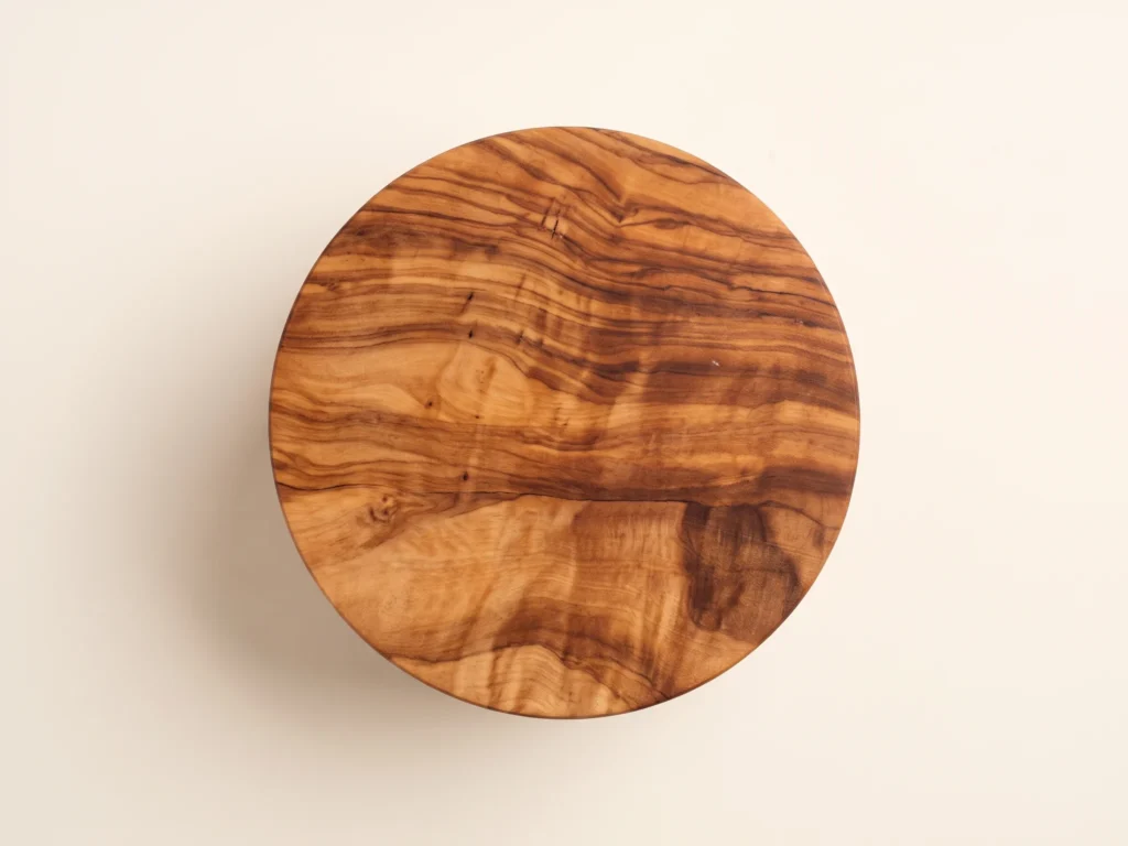 Top-down 90-degree overhead view of the olive wood salt keeper showing rich burl grain on flat lid
