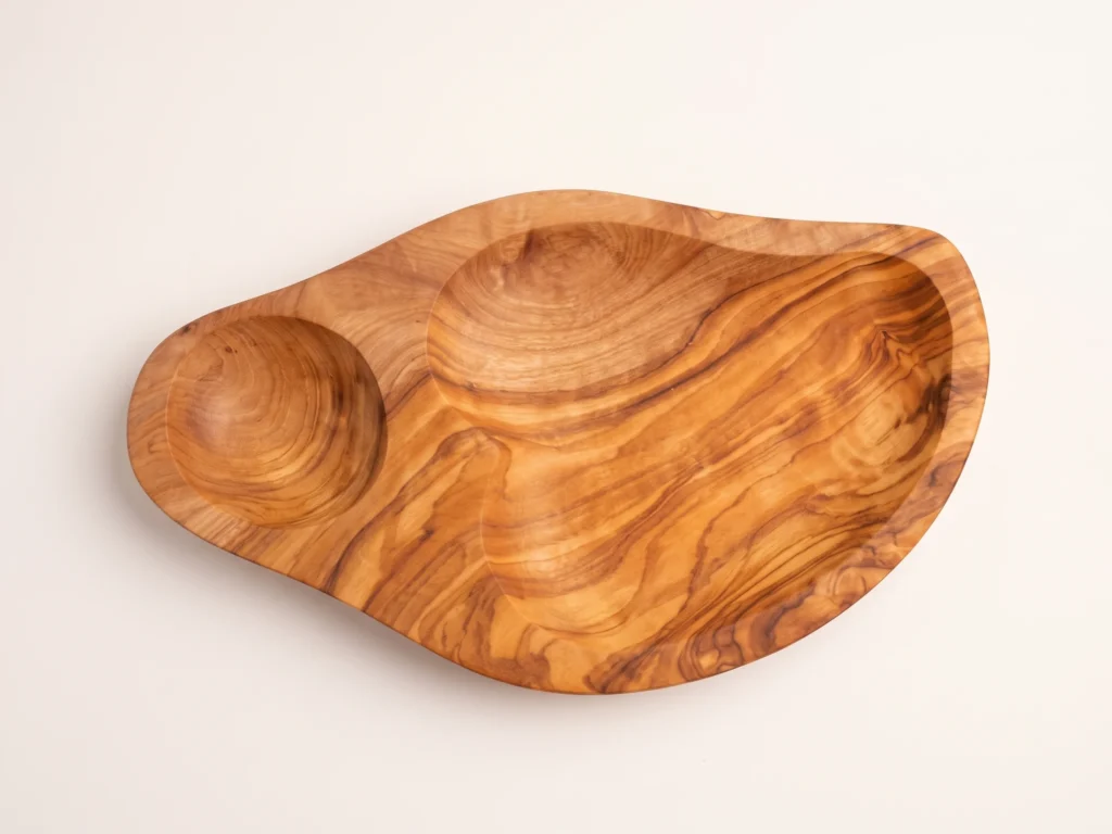 Direct top-down 90-degree view of olive dish BL-15 highlighting circular pit cup and flowing serving basin