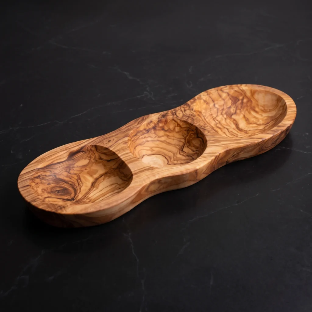 Handcrafted 3-section olive wood appetizer platter on rustic stone tabletop