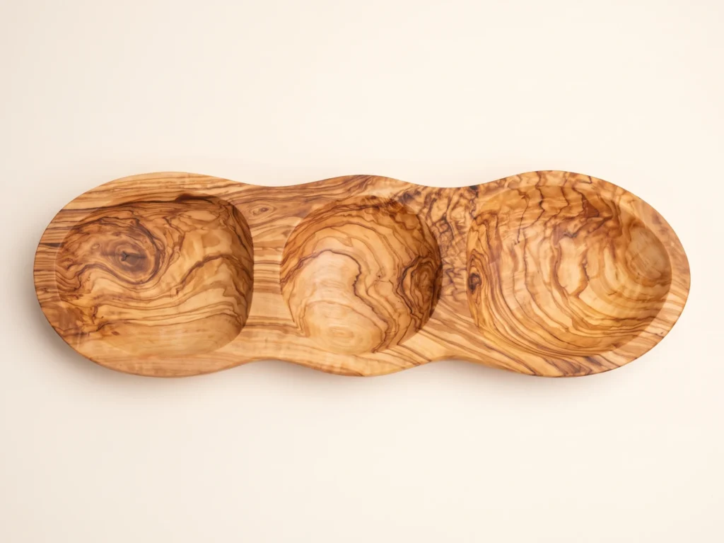 Direct top-down 90-degree view of appetizer platter BL-24 showing three circular hollowed compartments and undulating rim