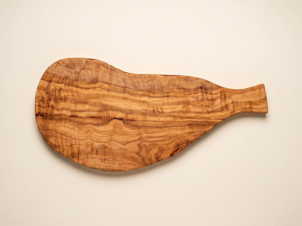 Natural shaped olive wood cutting board with handle overhead 90-degree technical view
