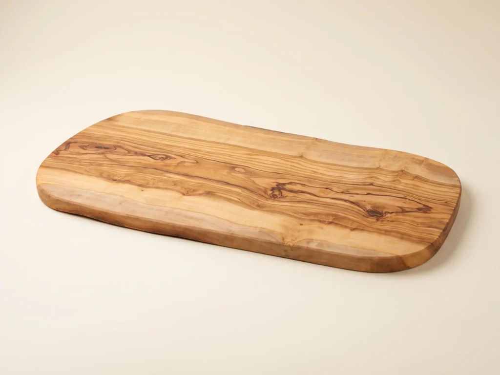 Natural shaped olive wood cutting board low three-quarter view