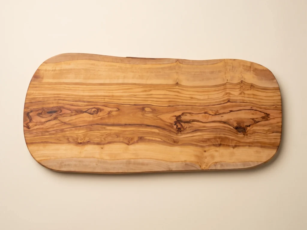 Natural shaped olive wood cutting board overhead 90-degree technical view