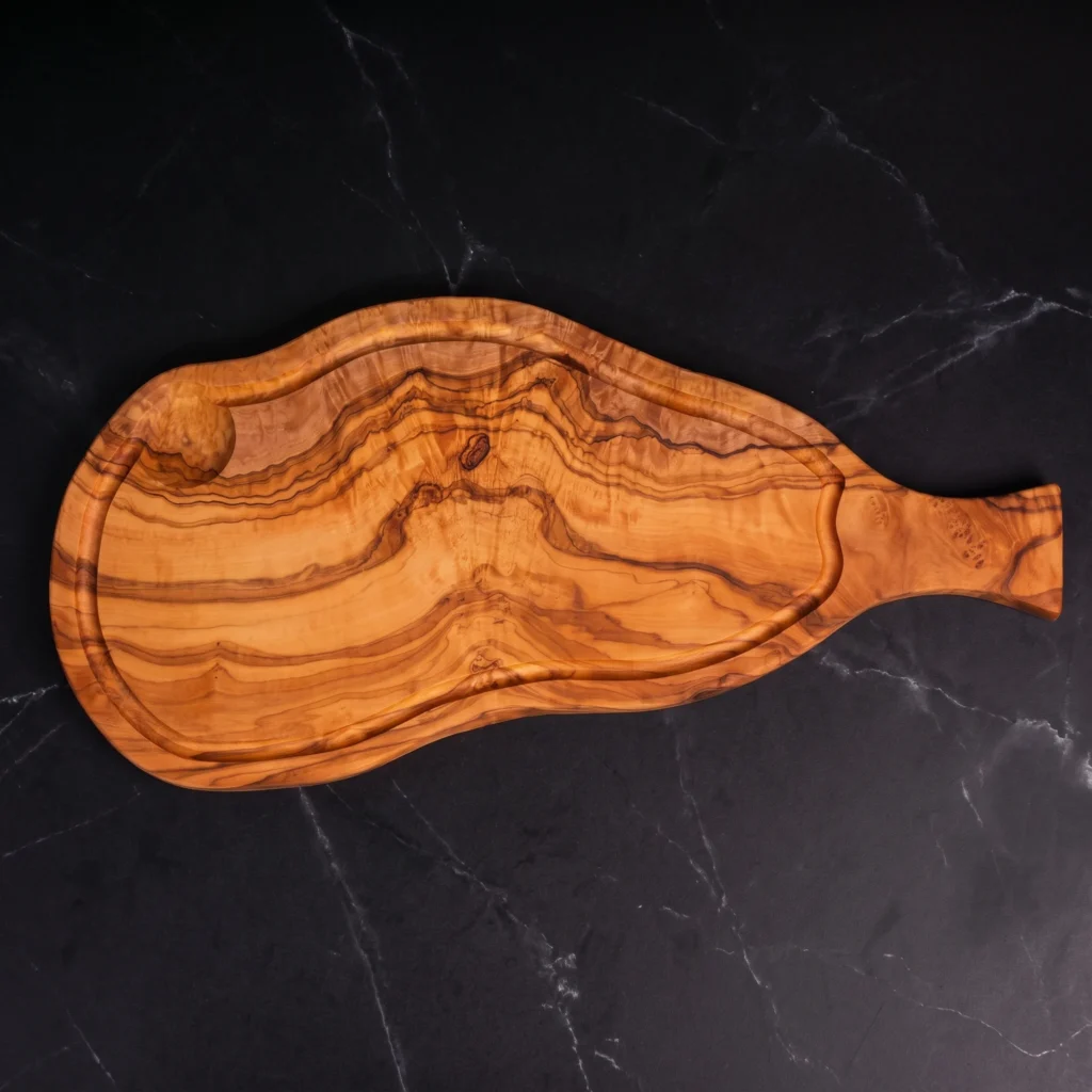 Natural shaped olive wood cutting board with juice groove and handle