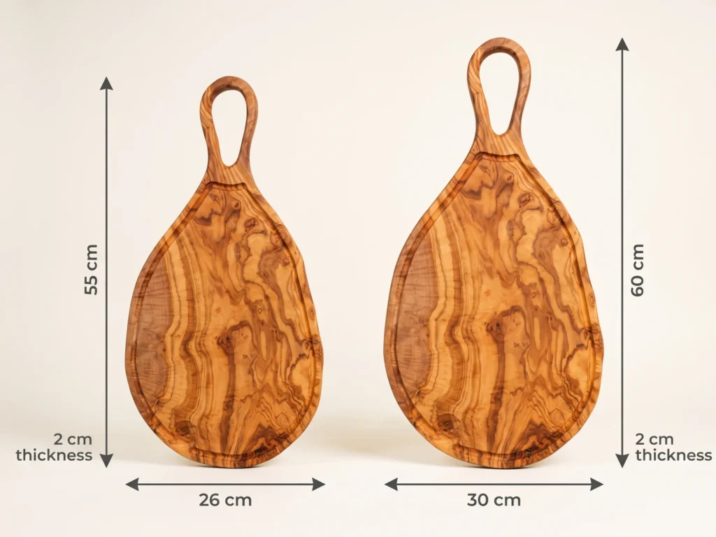 Large natural shaped olive wood cutting board with juice groove and hole size comparison showing 55x26 and 60x30 cm