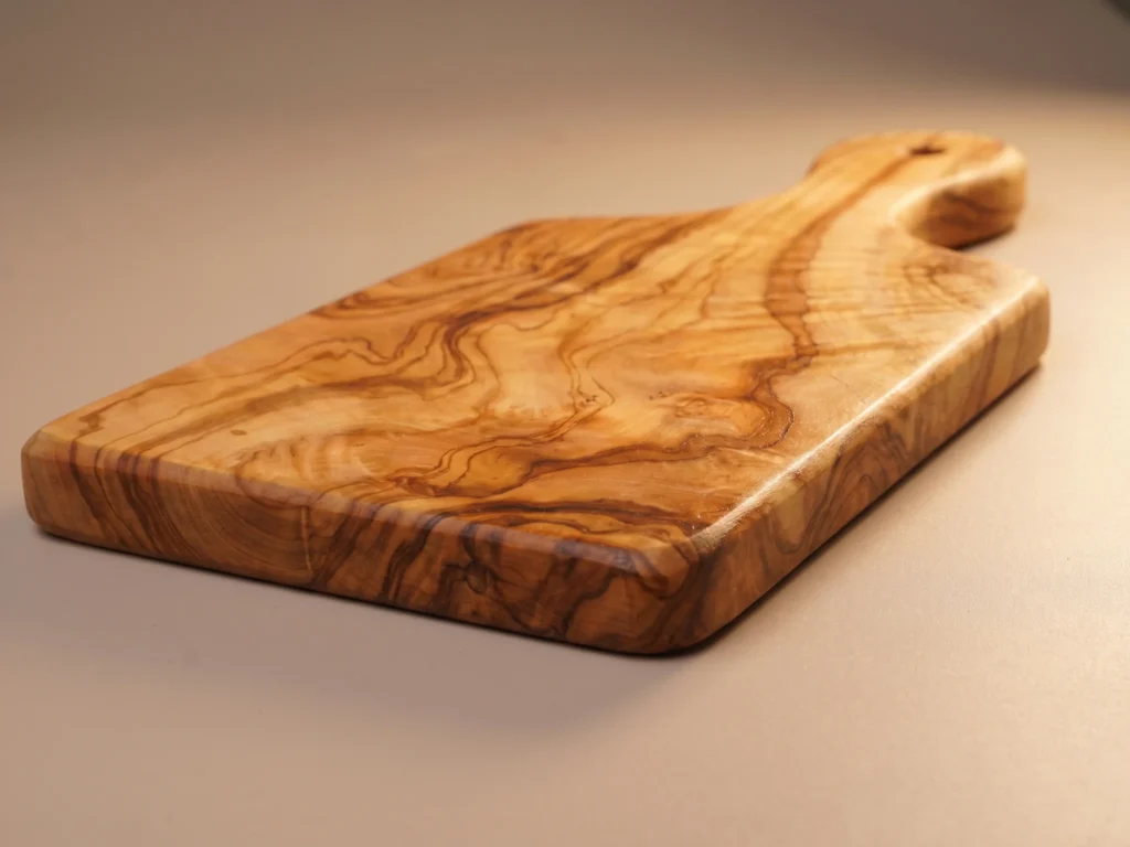 Olive wood persil board low-profile grazing edge view showing 1.8 cm thickness