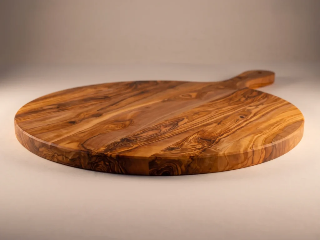 Round olive wood board with handle low-profile thickness view