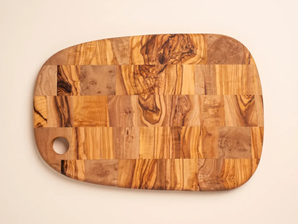 Special shape rounded olive wood cutting board overhead 90-degree view