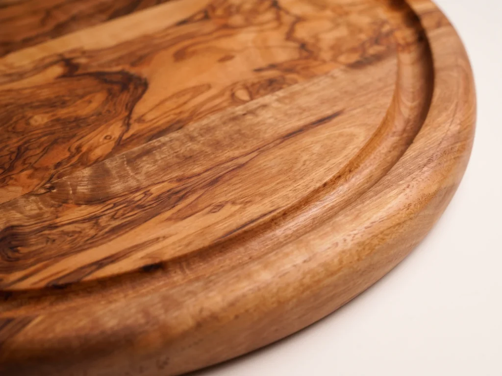 Round cheese board with groove macro detail view