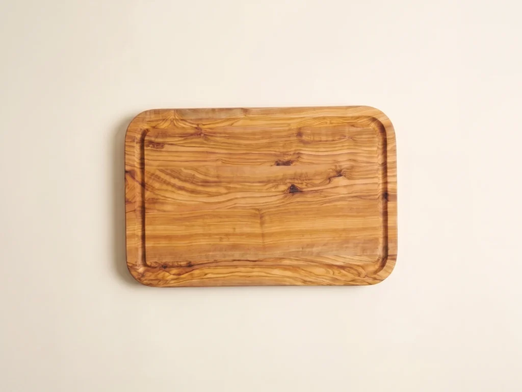 Rectangular edge-glued olive wood cutting board with rounded corners overhead 90-degree technical view