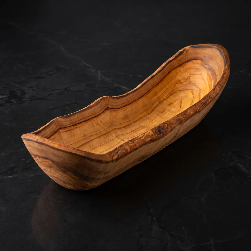 Rustic olive wood dish on black marble