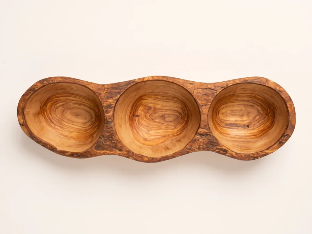 Top-down overhead view of rustic olive wood appetizer dish BL-3 showing 3 circular basins and live-edge bark rim