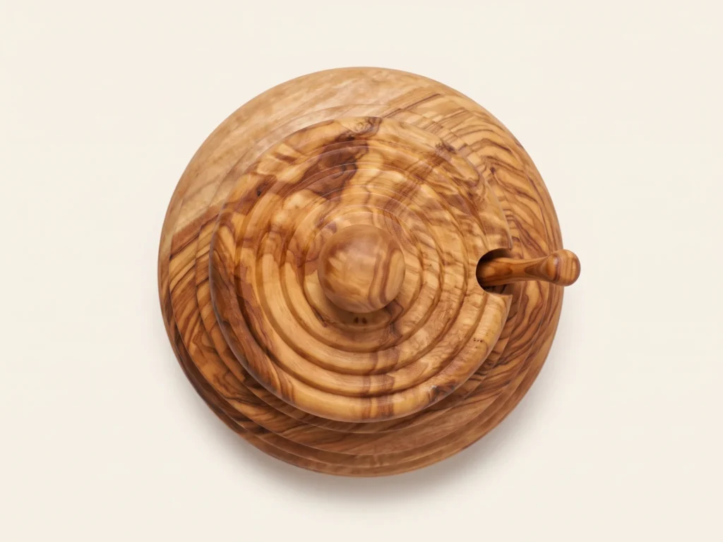 Overhead 90 degree technical view of olive wood honey jar beehive lid and dipper handle