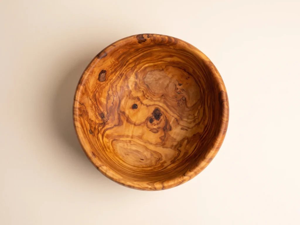 Top-down overhead view showing interior grain of olive wood salad bowl SL-1